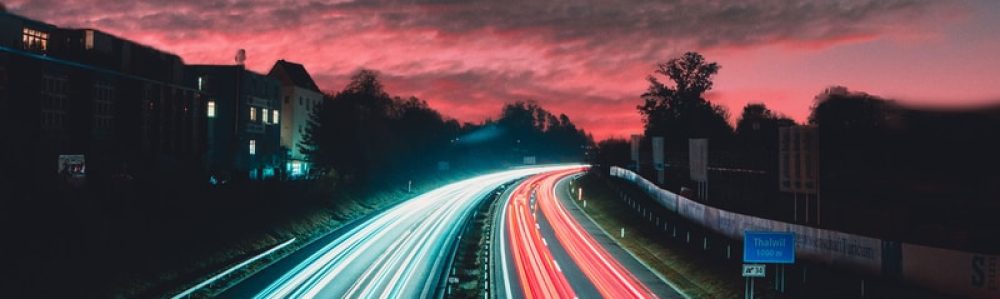 timelapse photography of vehicles at night