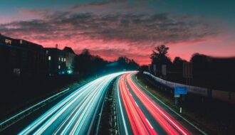 timelapse photography of vehicles at night